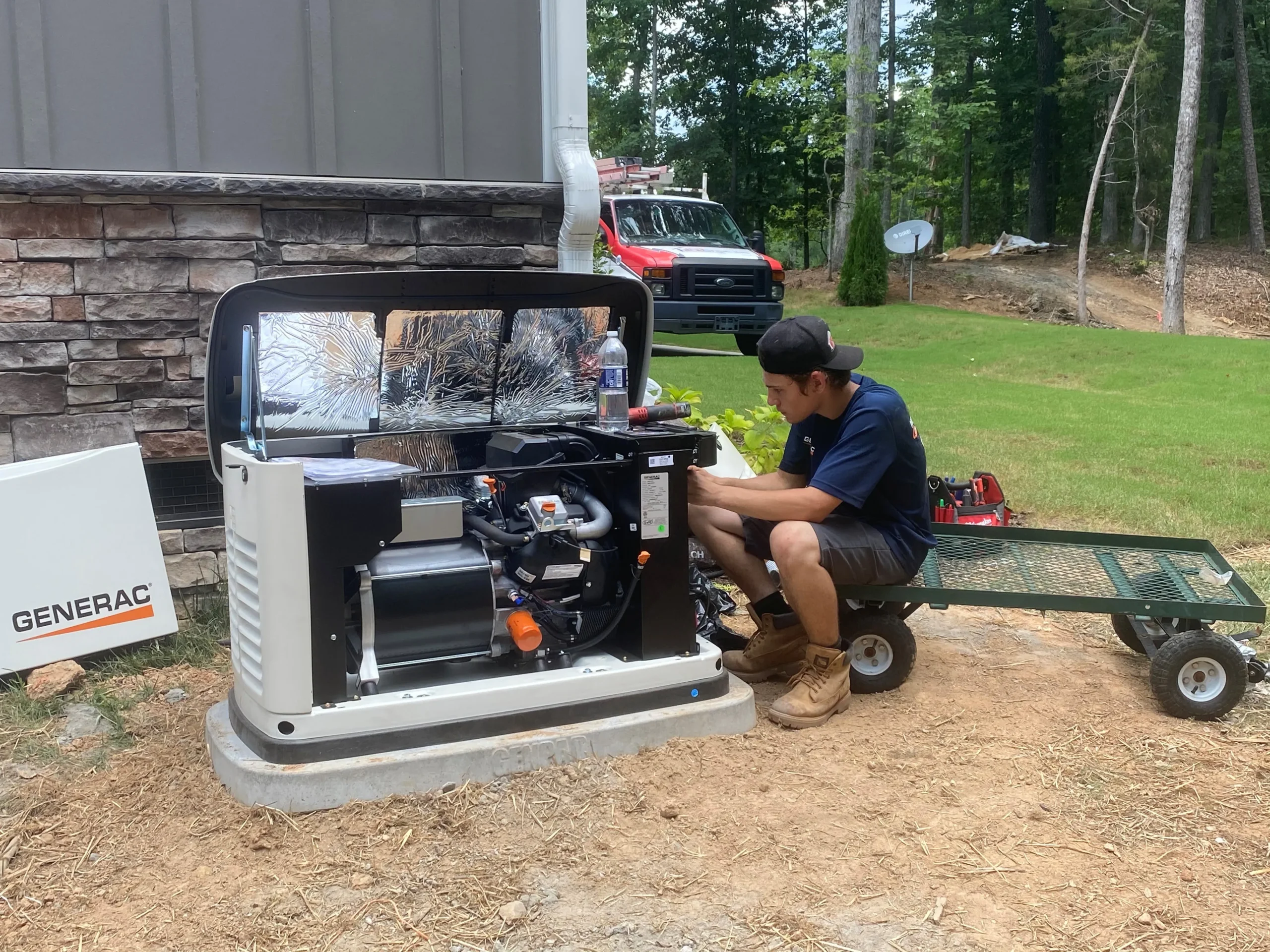 Technician performing maintenance on a generator, illustrating comprehensive generator care services